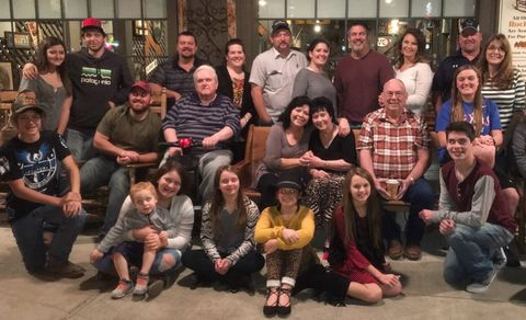 The church family gathered together for a group photo, with children seated in front